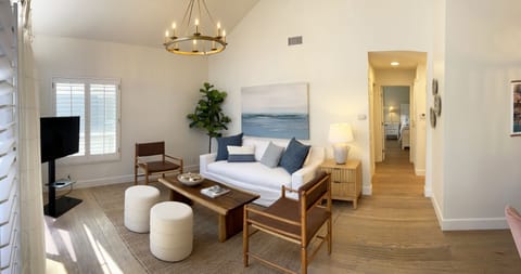Light and bright living room with clean, comfortable, and stylish seating!
