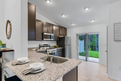 Kitchen Area Leading Out To The Back Yard