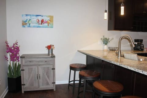 Start your day in style at our rental's charming breakfast bar area. Bask in the warm glow of morning sunlight as you enjoy a leisurely meal or sip on a freshly brewed cup of coffee.