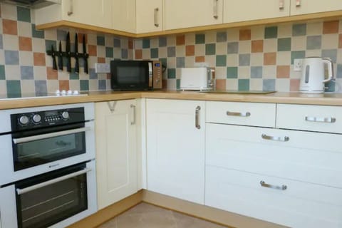 Well equipped family kitchen including double oven with grill and microwave