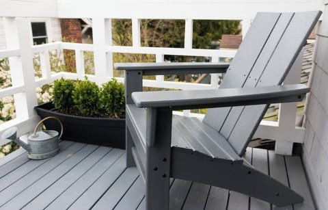 Adirondack chair on our 2nd floor balcony for sunset and evening city lights.
