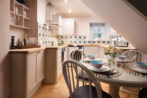 Bughtrig Cottage - with an open-plan living space, the cook of your party doesn't have to step away from the fun