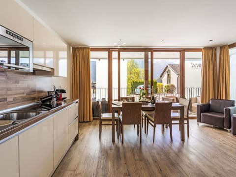 Furniture, Property, Cabinetry, Countertop, Chair, Kitchen Appliance, Wood, Table, Interior Design, Kitchen Stove