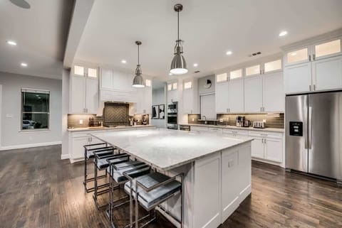 With granite countertops, stainless steel appliances, and a lovely oversized island, this premium kitchen is sure to delight!
