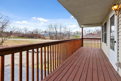 Upstairs-covered deck area off of kitchen