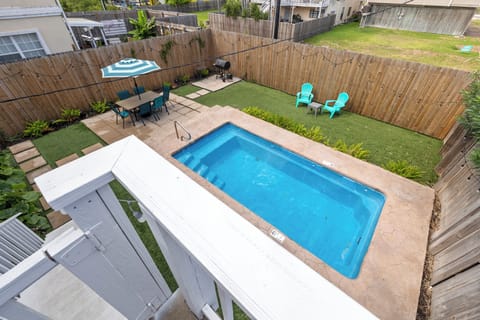 Spacious backyard with pool, seating & grill