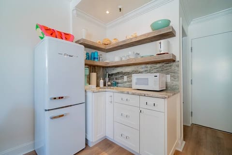 Enjoy the full size Classic retro refrigerator & freezer.  Kitchen is fully equipped with a portable cooktop in bottom drawer, microwave, Cafe toaster and coffee maker.