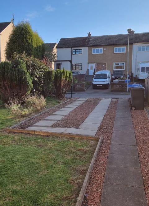 A view of the private driveway with space for one large or two small cars