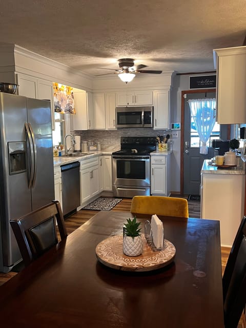 Back entry overlooks the farm with plenty of parking and half-circle driveway.  
