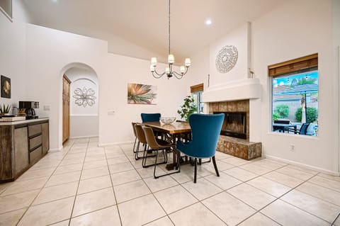 The dining room provides seating for 8 and is adjacent to additional seating.