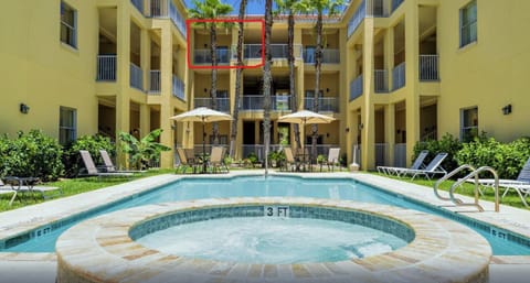 A view from the pool looking up to the condo