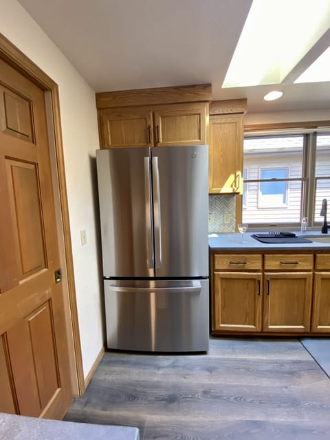 Large new refrigerator (xtra refrigerator, chest freezer,microwave in garage)