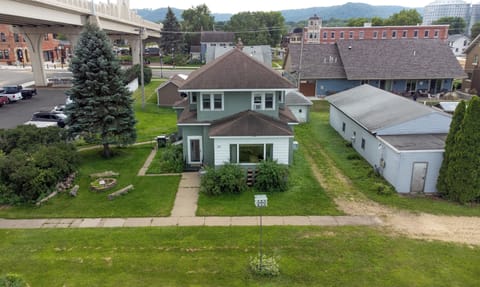 Front view of the home and front door. Parking to the right gravel driveway. 