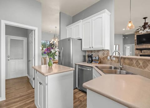 Standard appliances with refrigerator & bar seating for 4 addl guests.