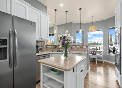 Fully stocked kitchen with lakeview sitelines & hard surface counters.