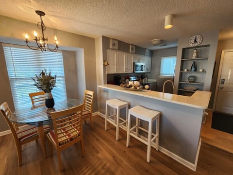 Kitchen with Bar Stool Seating and Dining Area