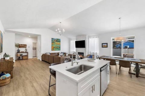 Open-concept living, dining, and kitchen areas.