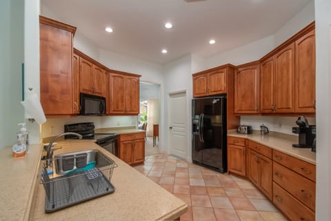 Spacious open kitchen makes meal prep a team sport.