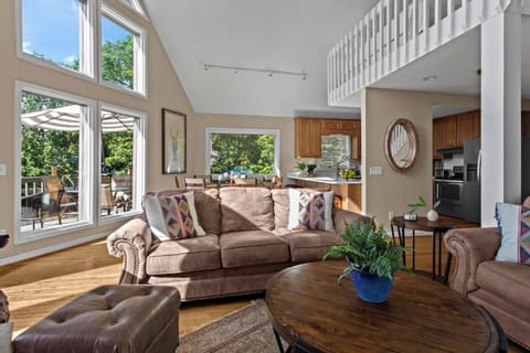 Enjoy a spacious open-concept layout with inviting, comfortable seating in the living area.