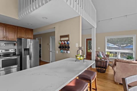 Bar stools are also available in the kitchen for extra seating.