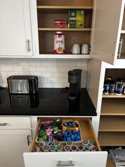 Keurig with K Cups, Sweetener and Creamer available.