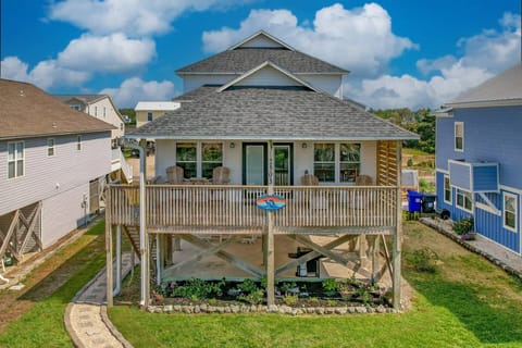 Front view of Dolphin Delight with a large porch located only 2 blocks from the ocean