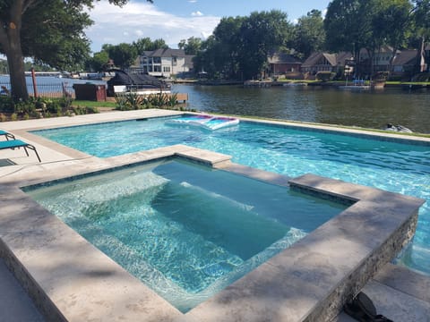 Elegant home with NEW 36x18' heated Pool/Spa(12'x8 Spa)w waterfall. Lush gardens