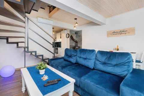 Living room with a comfortable sofa and TV. 