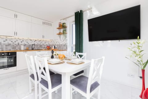 Large table with chairs for eating communal meals. 
