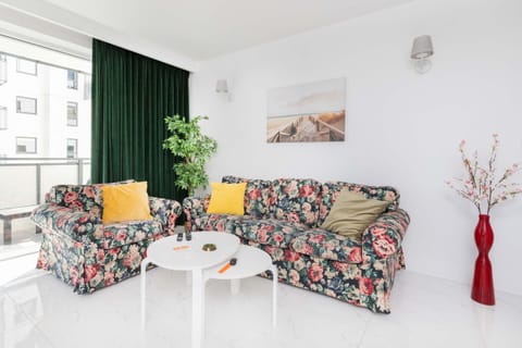 Living room with a comfortable sofa and TV. 