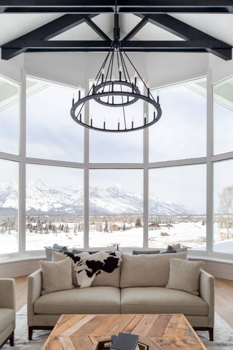 Lower level Great Room wall of windows framing the entire Teton range