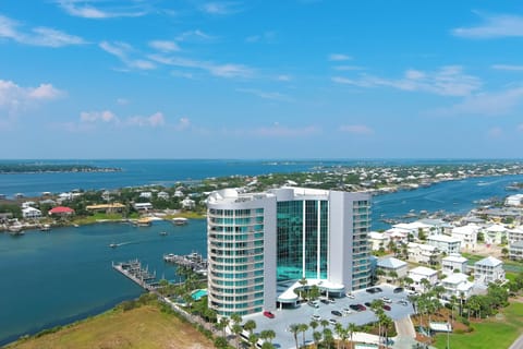 A serene marina scene unfolds, with the vast expanse of the Gulf of Mexico providing a breathtaking backdrop. The gentle rhythm of the bay meets the boundless energy of the open sea.