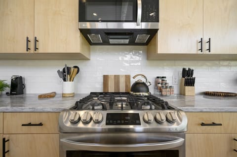 Kitchen Paradise: Whip up culinary delights in this sleek, modern gourmet kitchen!