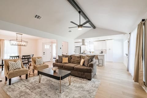 Living room with open floor plan. Perfect for gatherings. Family room has a 55" Smart Roku TV