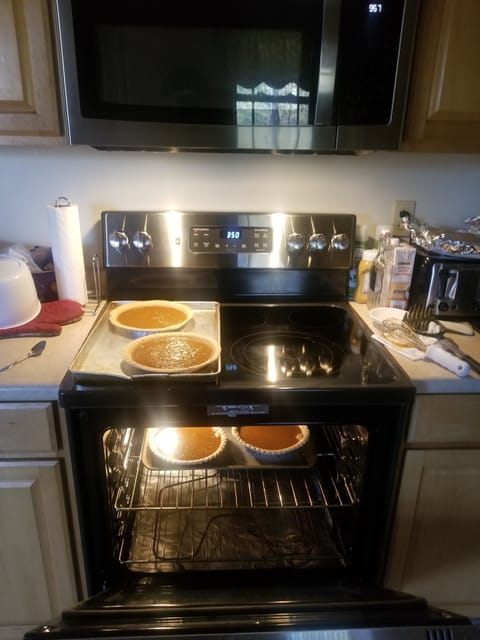 Full kitchen with fridge, stove, microwave, sink, and dishwasher. 