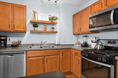 Cook up a storm in this bright space, featuring modern appliances and cheerful decor!