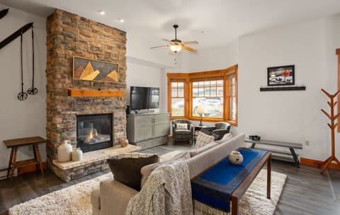 Living room with extra seating and bay window