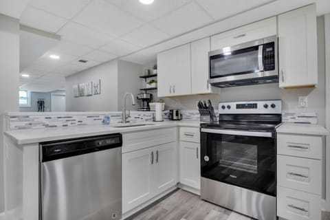 Fully equipped kitchen is well stocked for meals at home for extended stays!
