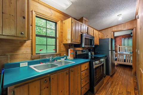 Cook in a fully equipped kitchen with modern appliances, perfect for family meals.