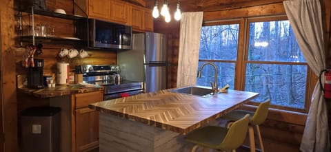 Floor-to-ceiling windows bring the outside in while you sip, stir, or serve something delicious.