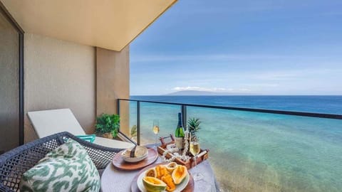 Unwind on a roomy oceanfront balcony with comfortable seating and panoramic views