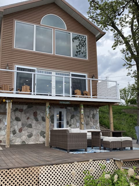 Multiple levels of decks and a lakeside firepit are perfect for taking in the lake views