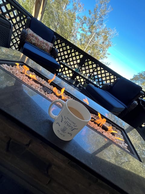 Enjoy a nice cup of coffee over an open fire on the porch