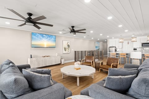 Surfside retreat sleeps up to 14 guests in beds and 2 in the pull-out sleeper sofa. Sheets for the sofa may be found in the upstairs closet. A half-bath just off the keeping room ensures all guests are comfortable during times of gathering.
