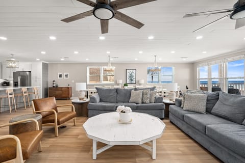 With gorgeous views of the Emerald Coast, your guests may spread out in comfort in the living room, dining room, kitchen, or rocking chair areas of the large keeping room.