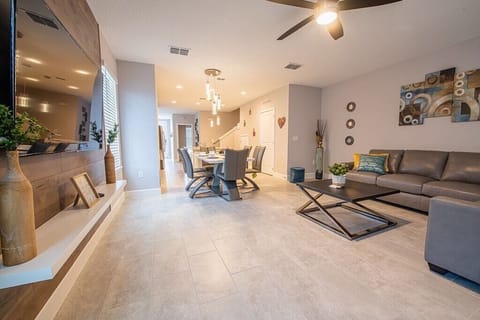 Open living space that seamlessly connects the beautiful kitchen and dining area, offering a perfect blend of comfort and style. You could enjoy a Smart TV and feel just like home!