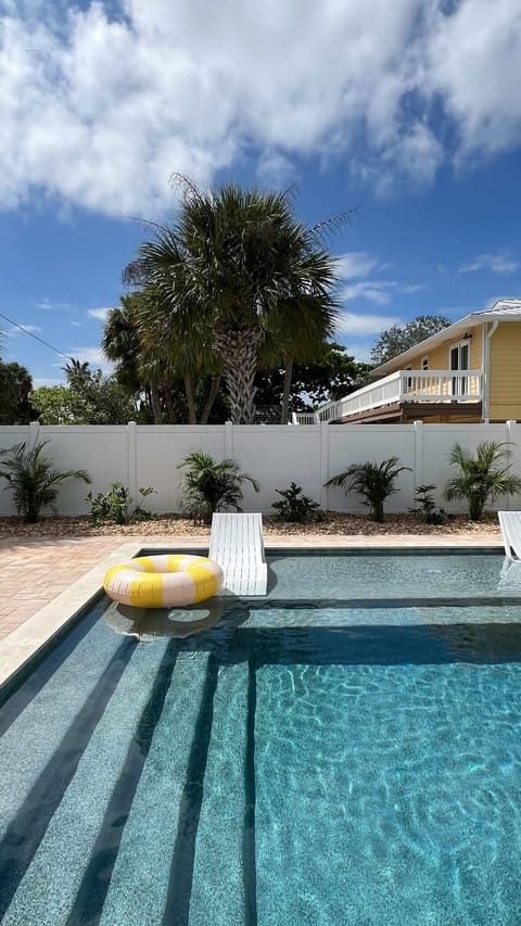 The backyard/pool area is a shared space with our sister cottage, Mango!