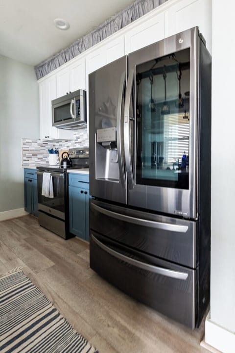 Kitchen with all needed cooking supplies and utensils. New appliances