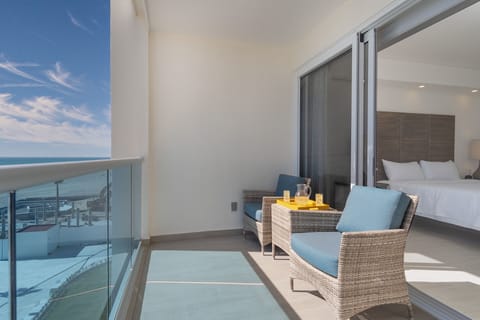 The bedroom opens onto the patio, and has seating.