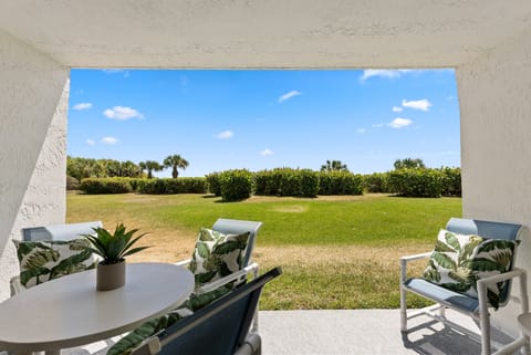 Ground floor walkout patio- steps from the beach!